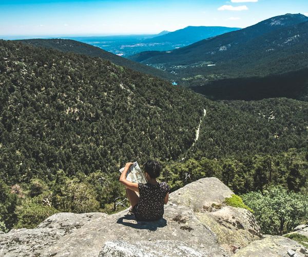 Person looking clearly into the distance at a beautiful natural landscape.