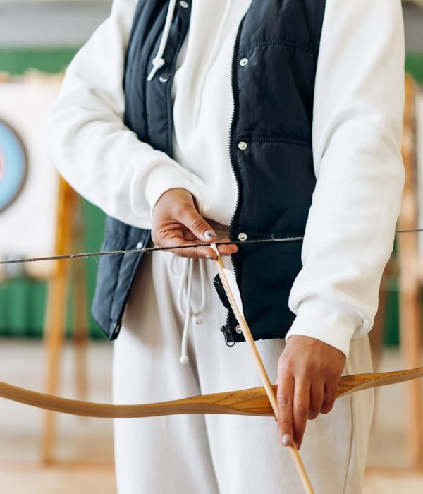 Woman practicing palming exercise with hands over her eyes in a calm environment.